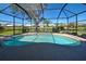 Private in-ground screened pool with tranquil lake views, and serene backyard oasis at 1125 Deardon Dr, Venice, FL 34292
