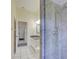Bathroom shower with modern fixtures and stylish tile, enhancing the bathroom's aesthetic at 1125 Deardon Dr, Venice, FL 34292