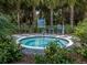 Community hot tub surrounded by lush landscaping at 11575 Okaloosa Dr, Venice, FL 34293