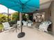 Lanai with various seating options, including chairs, a sofa and a glass-topped table at 11575 Okaloosa Dr, Venice, FL 34293