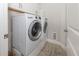 Well-equipped laundry room features an LG washer, dryer and wood-look tile floors at 11575 Okaloosa Dr, Venice, FL 34293