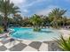 Resort-style pool with island feature and palm trees at 11575 Okaloosa Dr, Venice, FL 34293