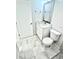 Bright bathroom with white vanity, marble countertops, and tiled floor at 12390 Talavera St, North Port, FL 34287