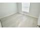 An empty bedroom featuring clean floors, natural lighting, and neutral walls at 12390 Talavera St, North Port, FL 34287