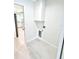 Neutral laundry area featuring washer/dryer hookups with views of kitchen at 12390 Talavera St, North Port, FL 34287