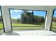 View from screened in porch of the lush landscaping at 12390 Talavera St, North Port, FL 34287