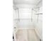 Neat walk-in closet featuring adjustable shelving at 12390 Talavera St, North Port, FL 34287