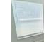 A close-up of a window with white blinds, letting in natural light at 12390 Talavera St, North Port, FL 34287