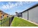 Fenced backyard with green grass, showcasing the property's canal-front location at 15688 Melport Cir, Port Charlotte, FL 33981