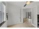 View of the bedroom with tiled flooring and access to another room at 15688 Melport Cir, Port Charlotte, FL 33981