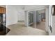 Open kitchen area with stainless steel appliances and a view of the outdoor patio through sliding glass doors at 15688 Melport Cir, Port Charlotte, FL 33981