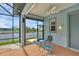 View from screened lanai; relax by the water with outdoor seating and serene canal views at 15688 Melport Cir, Port Charlotte, FL 33981