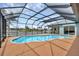 Enjoy outdoor living with a screened lanai, private pool, and picturesque canal views for relaxation at 15688 Melport Cir, Port Charlotte, FL 33981