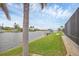 Lush backyard with a view of the canal and a private boat dock at 15688 Melport Cir, Port Charlotte, FL 33981