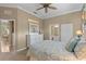 Cozy bedroom with seashell themed décor, carpet flooring and a white dresser at 1596 Monarch Dr # 1596, Venice, FL 34293