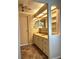 Bathroom vanity with marble countertops, drawers, sink and decorative wallpaper at 16 Nautical Dr, North Port, FL 34287