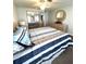 Bedroom with a dresser, mirror, ceiling fan, and a comfortable bed at 16 Nautical Dr, North Port, FL 34287