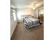 Comfortable bedroom featuring carpeted floors, a ceiling fan, and a closet at 16 Nautical Dr, North Port, FL 34287