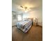 Cozy bedroom with a ceiling fan, a comfortable bed, and carpeted floors at 16 Nautical Dr, North Port, FL 34287