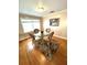 Well-lit dining area showcasing a glass-top table with seating for four at 16 Nautical Dr, North Port, FL 34287