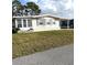 Inviting single-story home featuring classic siding and well-maintained lawn in quiet neighborhood at 16 Nautical Dr, North Port, FL 34287