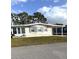 Well-maintained single-story home with covered parking and manicured lawn showcasing suburban living at 16 Nautical Dr, North Port, FL 34287