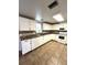 Functional kitchen with white cabinets, modern appliances, and easy-to-clean tile floors at 16 Nautical Dr, North Port, FL 34287