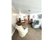 Open living area featuring comfortable seating and a view into the dining space at 16 Nautical Dr, North Port, FL 34287