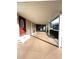 Covered patio featuring a red front door, concrete flooring, and white support pillars at 16 Nautical Dr, North Port, FL 34287