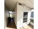 Enclosed porch featuring ample natural light and a screen door at 16 Nautical Dr, North Port, FL 34287