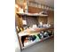 Workbench area with shelving, tools, and various supplies at 16 Nautical Dr, North Port, FL 34287
