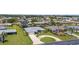 Beautiful single-story home with a well-manicured front yard and circular driveway at 1726 Claw Ct, Venice, FL 34293