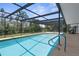Inviting screened-in pool offering a relaxing escape with easy access via convenient pool stairs at 1726 Claw Ct, Venice, FL 34293