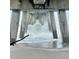 Unique perspective under a pier, capturing the powerful waves and architectural support at 1726 Claw Ct, Venice, FL 34293
