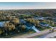 Community aerial view showcasing a neighborhood surrounded by lush trees in a serene environment at 177 Ingram Blvd, Rotonda West, FL 33947