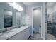 Bathroom featuring double vanity with granite counters and tiled shower at 177 Ingram Blvd, Rotonda West, FL 33947