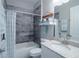 Bathroom features tiled shower and tub combo with granite countertop vanity at 177 Ingram Blvd, Rotonda West, FL 33947
