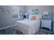 Bedroom featuring queen bed, two nightstands, and coastal-themed decor at 177 Ingram Blvd, Rotonda West, FL 33947
