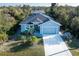 Blue home with a two-car garage and landscaped front yard; great curb appeal at 177 Ingram Blvd, Rotonda West, FL 33947