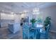 Open kitchen layout with stainless steel appliances, granite island, and adjacent dining area at 177 Ingram Blvd, Rotonda West, FL 33947