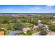 Aerial view of the property nestled within a community with access to a golf course and serene water features at 1995 White Feather Ln, Nokomis, FL 34275