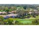 Aerial view of golf course homes with screened in pools, backing onto the lush green course at 1995 White Feather Ln, Nokomis, FL 34275