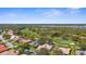 Aerial view of a golf course community highlighting the property's location and neighborhood layout at 1995 White Feather Ln, Nokomis, FL 34275
