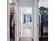 Walk-in closets leading to the bathroom give plenty of space for storage at 1995 White Feather Ln, Nokomis, FL 34275