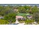 Beautiful home in a golf course community features lush landscaping, a green lawn and solar panels at 1995 White Feather Ln, Nokomis, FL 34275