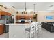 Open kitchen featuring an eat-in breakfast bar with seating at 1995 White Feather Ln, Nokomis, FL 34275