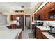 Kitchen area featuring stainless steel appliances and white countertops at 1995 White Feather Ln, Nokomis, FL 34275