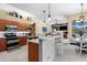 Spacious kitchen with stainless steel appliances and a breakfast bar at 1995 White Feather Ln, Nokomis, FL 34275