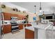 Kitchen area featuring stainless steel appliances, and white countertops at 1995 White Feather Ln, Nokomis, FL 34275