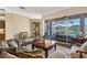 Bright living room with view of lanai and pool, featuring stylish furnishings and decor at 1995 White Feather Ln, Nokomis, FL 34275